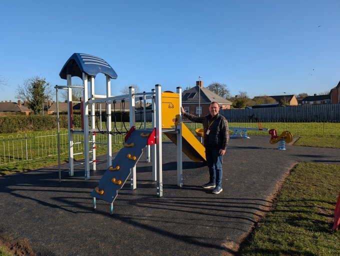 Cllr Wyatt at Cropston Drive play area in the sun